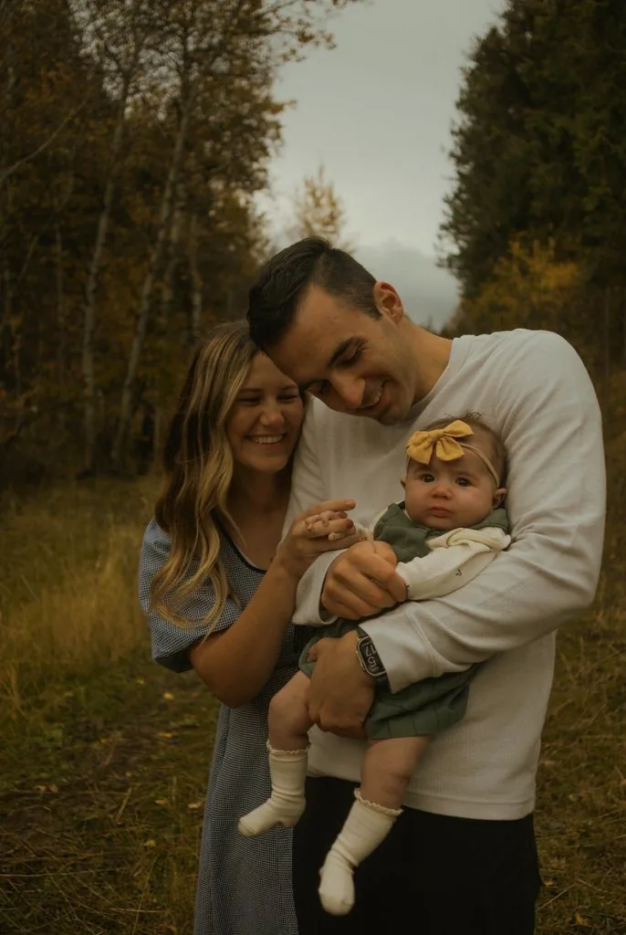 Casey holding her daughter Tatum in the fall